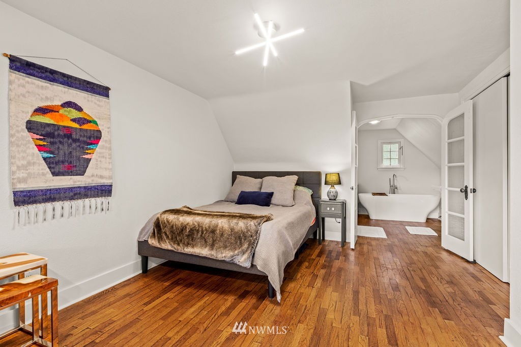 2002 Madrona Point Bremerton, WA 98312 - Photo 13 of 40 a bedroom with a bed and a painting on the wall