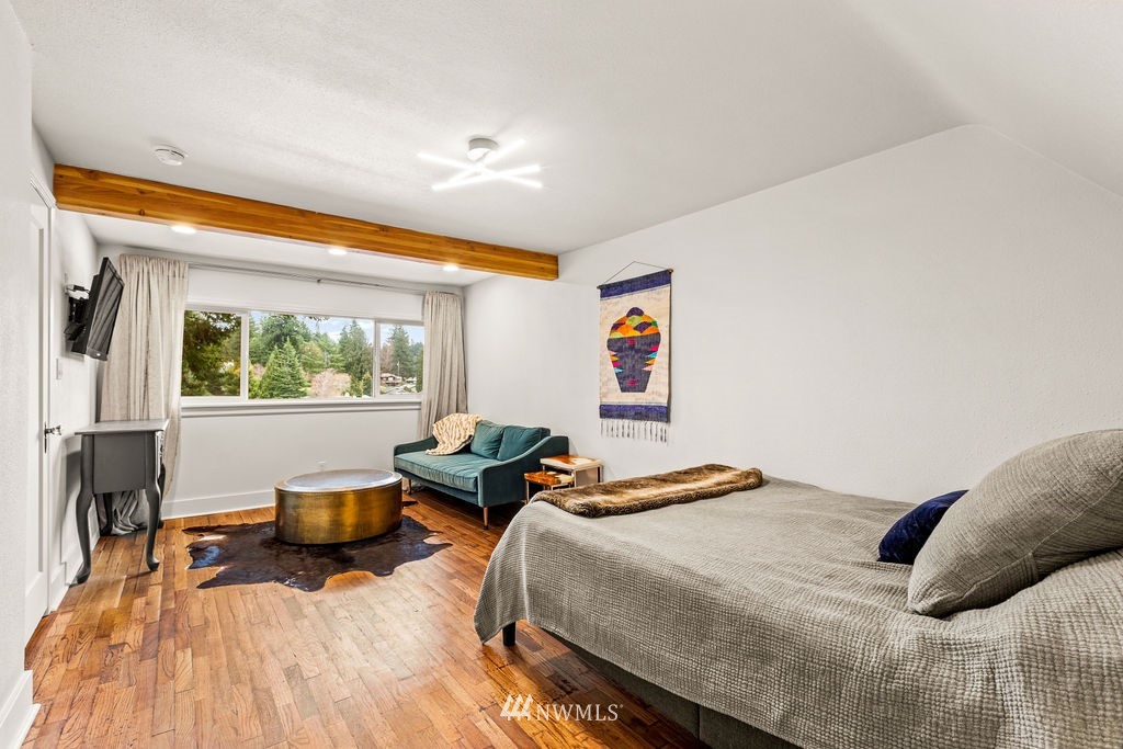 2002 Madrona Point Bremerton, WA 98312 - Photo 14 of 40 a bedroom with a bed and wooden floor