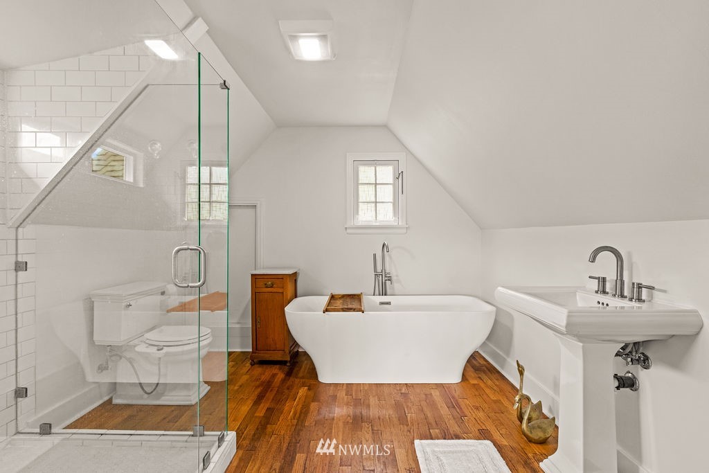 2002 Madrona Point Bremerton, WA 98312 - Photo 15 of 40 a bathroom with a sink a mirror and a shower