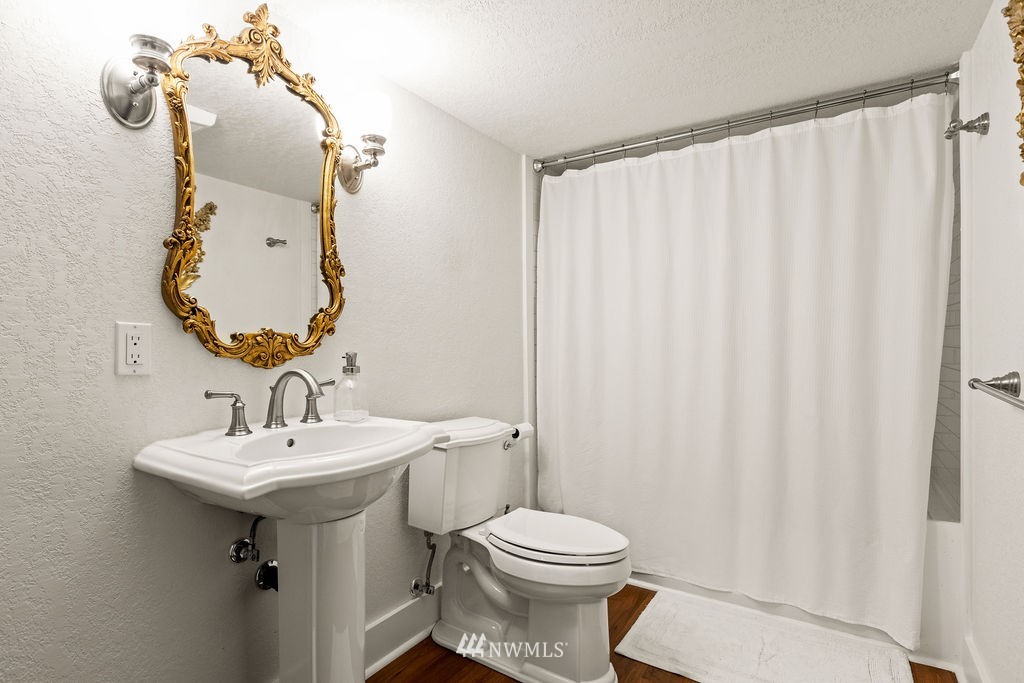 2002 Madrona Point Bremerton, WA 98312 - Photo 20 of 40 a bathroom with a sink toilet and mirror