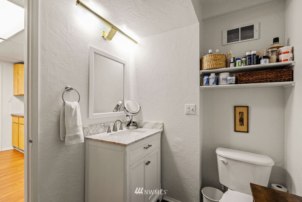 2002 Madrona Point Bremerton, WA 98312 - Photo 25 of 40 a bathroom with a toilet sink and mirror