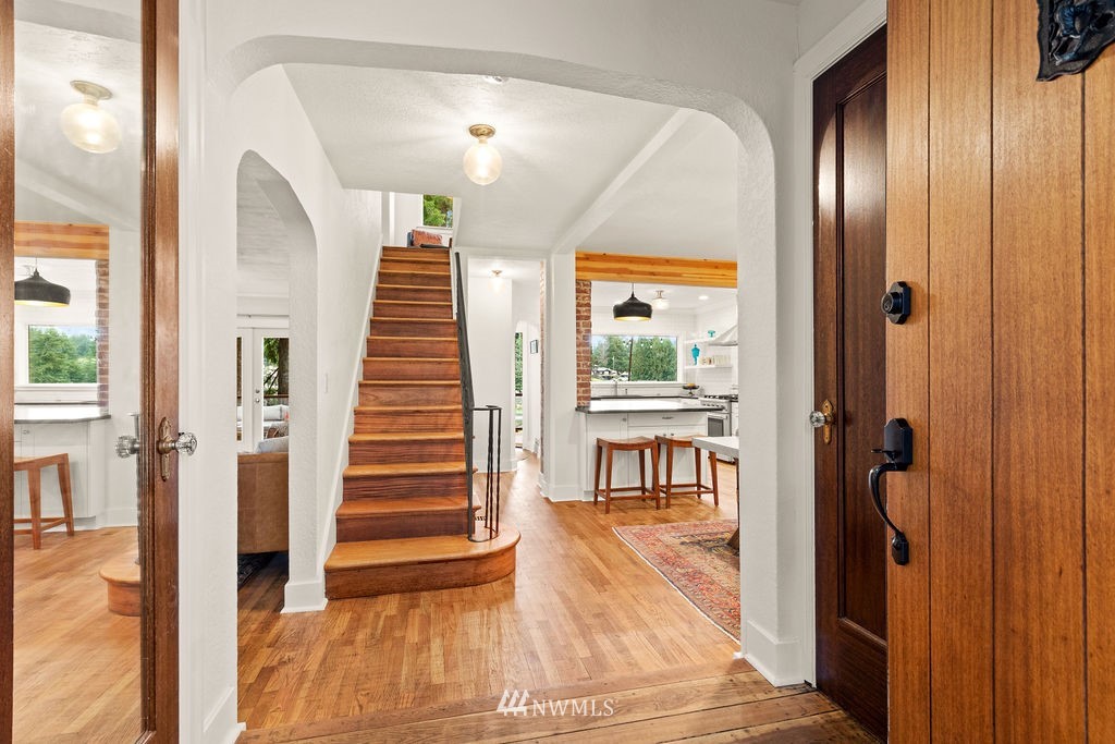 2002 Madrona Point Bremerton, WA 98312 - Photo 3 of 40 a view of a hallway with wooden floor and entryway