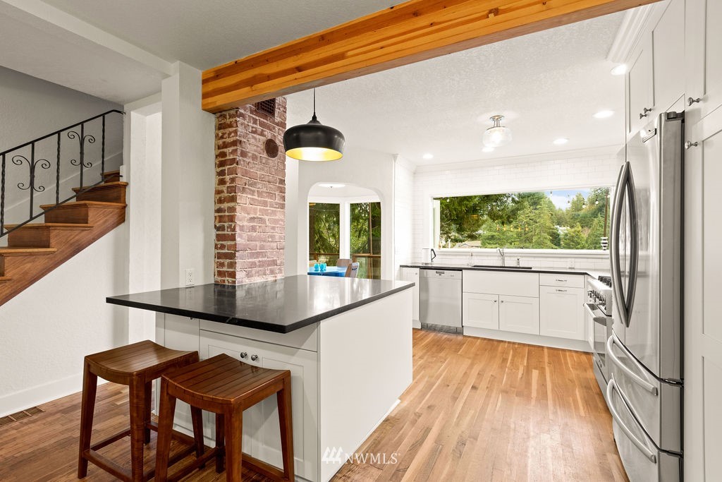 2002 Madrona Point Bremerton, WA 98312 - Photo 5 of 40 a kitchen with stainless steel appliances a sink and a stove