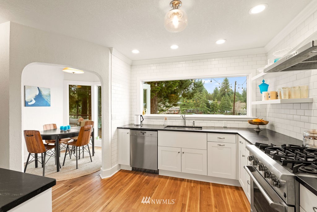 2002 Madrona Point Bremerton, WA 98312 - Photo 6 of 40 a kitchen with stainless steel appliances granite countertop a stove and a sink