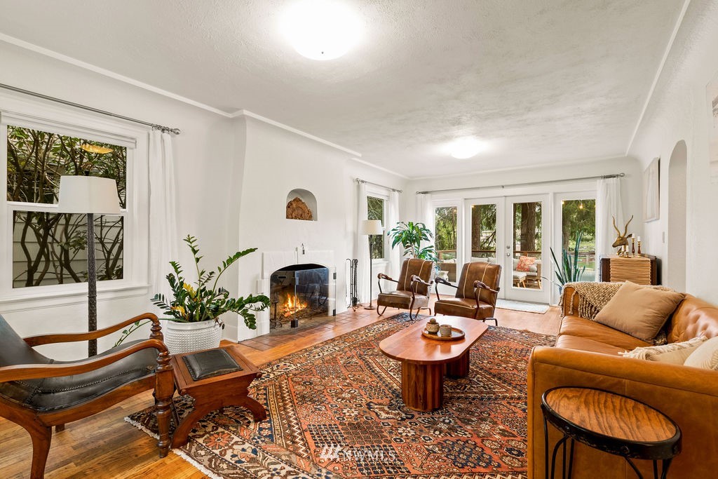 2002 Madrona Point Bremerton, WA 98312 - Photo 10 of 40 a living room with furniture potted plant a fireplace and a window