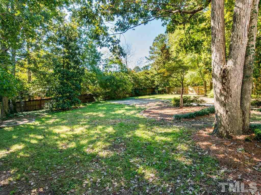 6925 Electra Drive Raleigh, NC 27607 - Photo 12 of 25 a backyard of a house with lots of green space