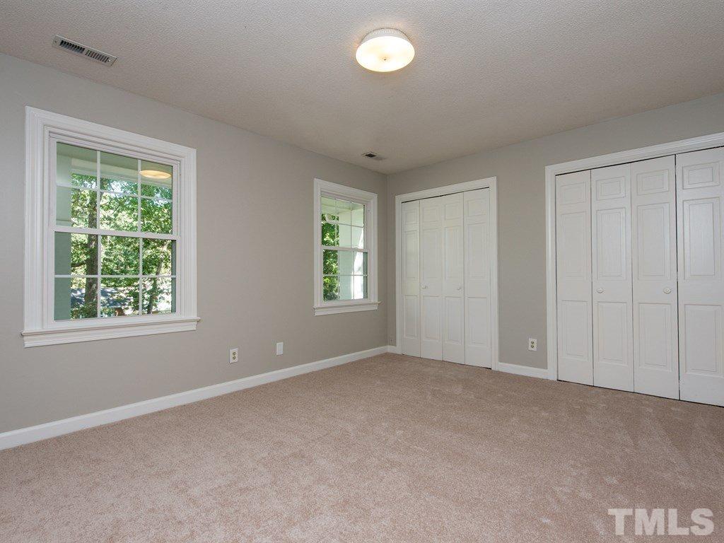 6925 Electra Drive Raleigh, NC 27607 - Photo 14 of 25 an empty room with windows