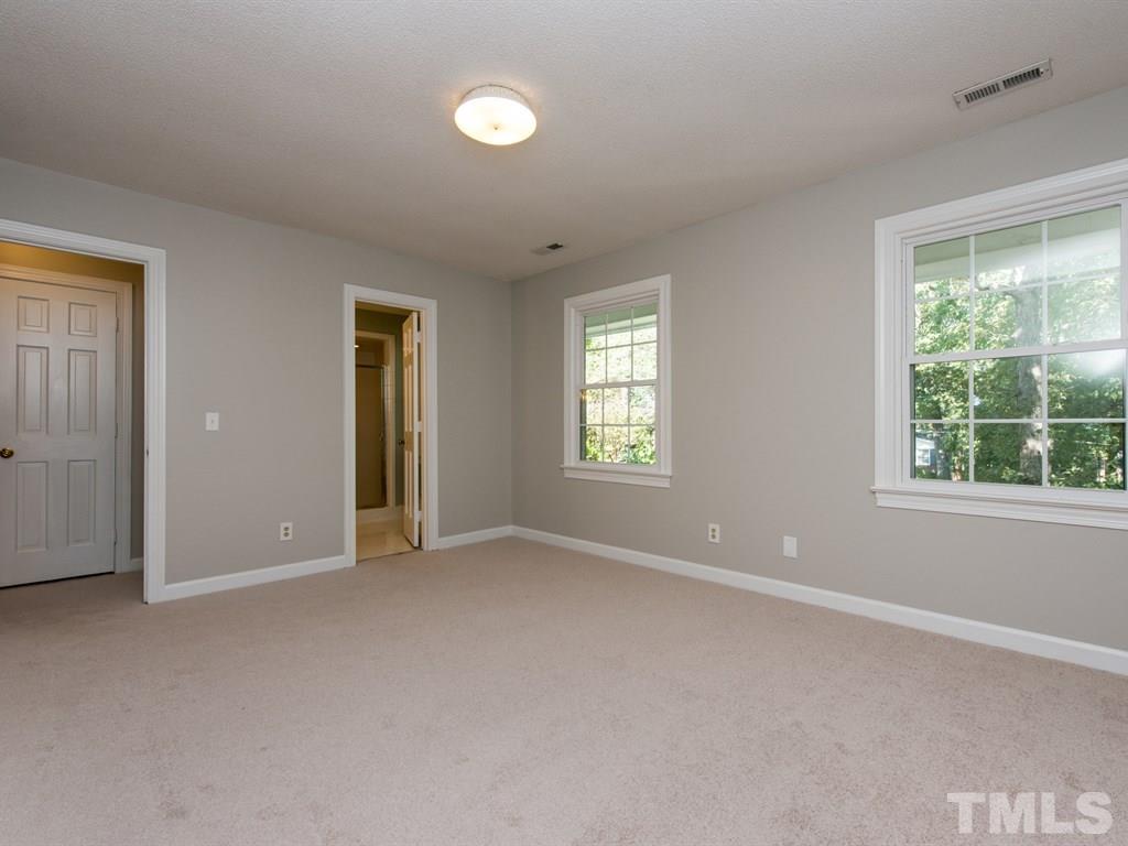 6925 Electra Drive Raleigh, NC 27607 - Photo 15 of 25 an empty room with windows and closet area