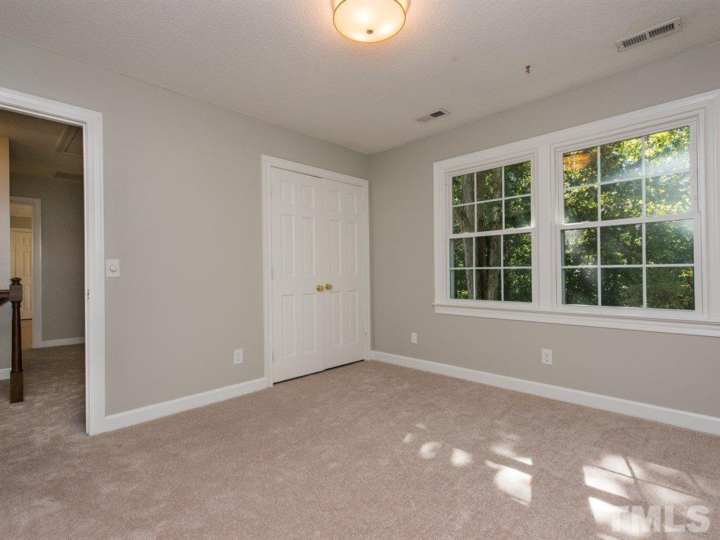 6925 Electra Drive Raleigh, NC 27607 - Photo 18 of 25 a view of an empty room with a window