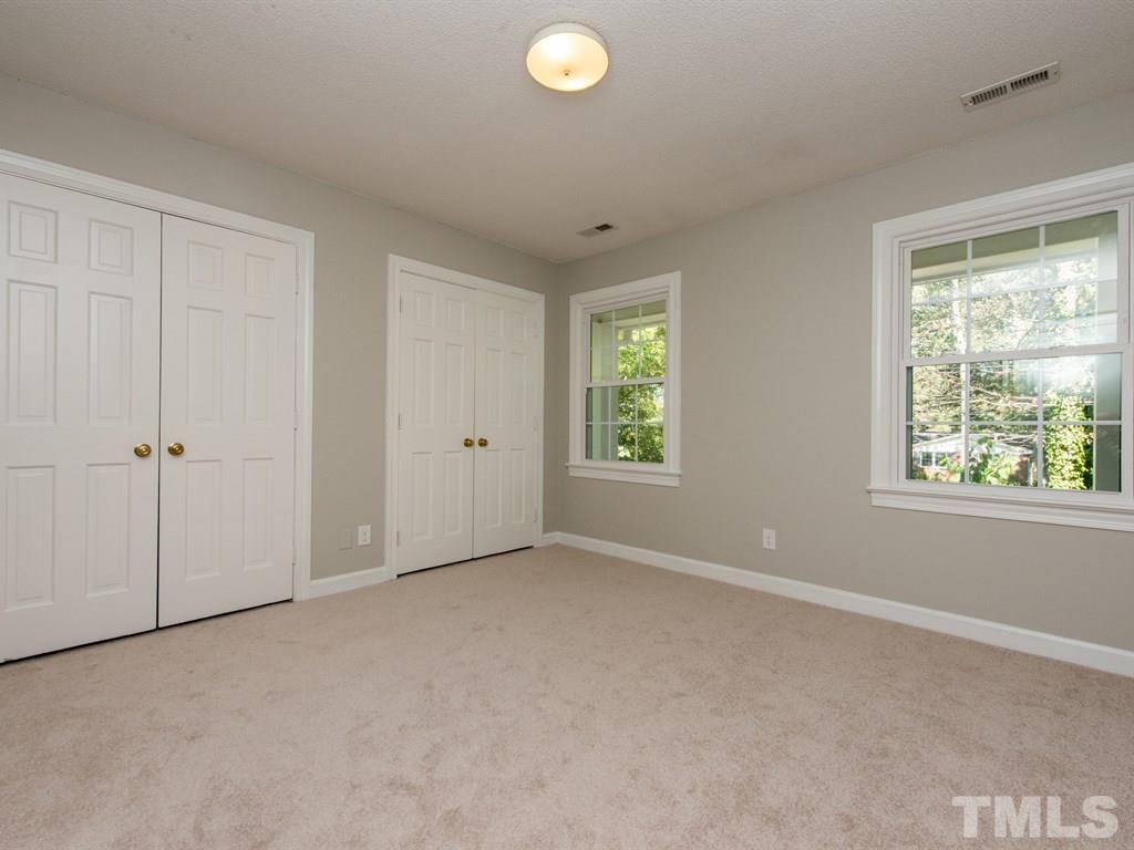 6925 Electra Drive Raleigh, NC 27607 - Photo 20 of 25 an empty room with windows and closet
