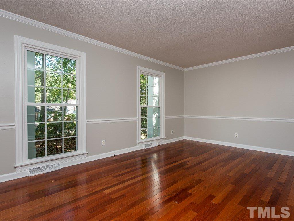6925 Electra Drive Raleigh, NC 27607 - Photo 3 of 25 a view of wooden floor and windows in a room