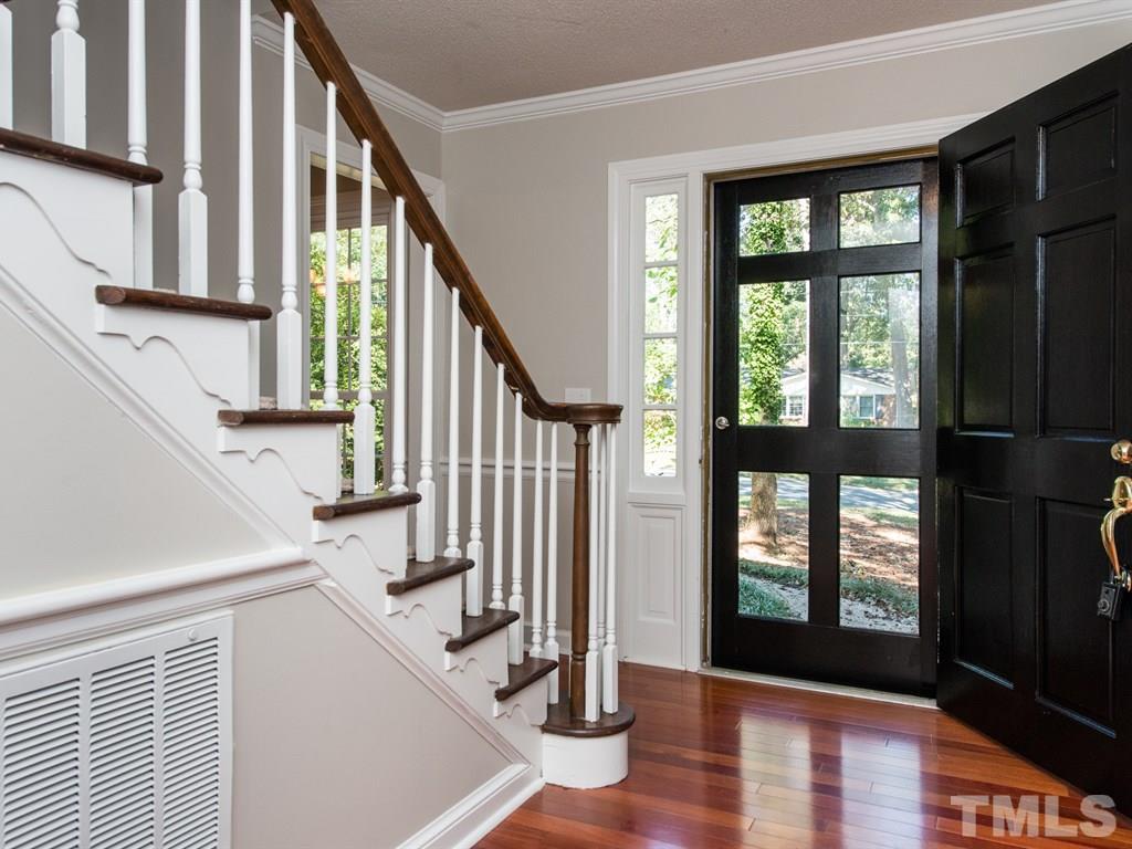 6925 Electra Drive Raleigh, NC 27607 - Photo 21 of 25 a view of an entryway with wooden floor and door