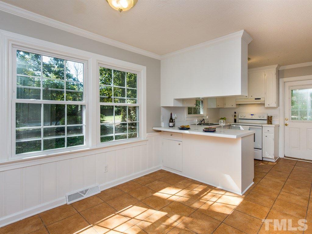 6925 Electra Drive Raleigh, NC 27607 - Photo 7 of 25 a kitchen with a window a sink and a stove top oven