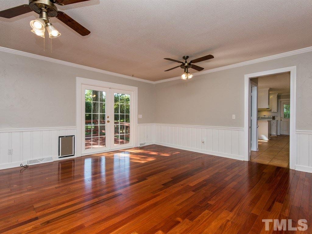 6925 Electra Drive Raleigh, NC 27607 - Photo 10 of 25 a view of an empty room with wooden floor and a window