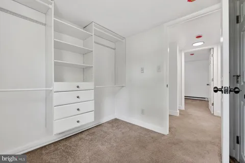 a view of an empty walk in closet