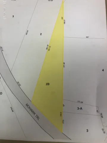 a bathroom with a tub and shower