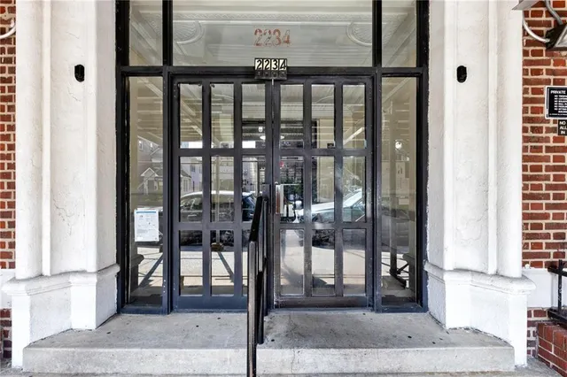 a front view of a building with a porch