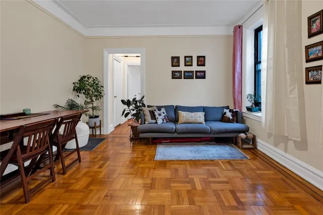 a living room with furniture rug and window