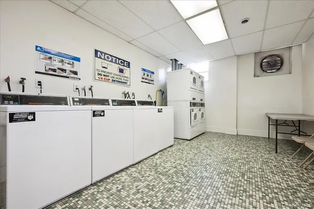 a kitchen with stainless steel appliances a refrigerator and a stove top oven