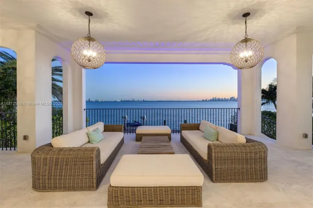 a balcony with furniture and wooden floor