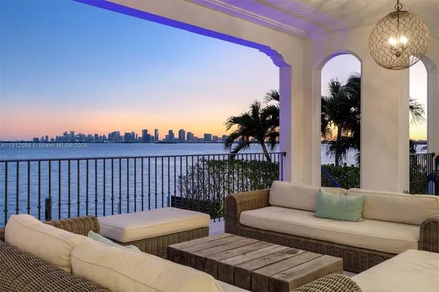 a view of a livingroom with furniture and a potted plant