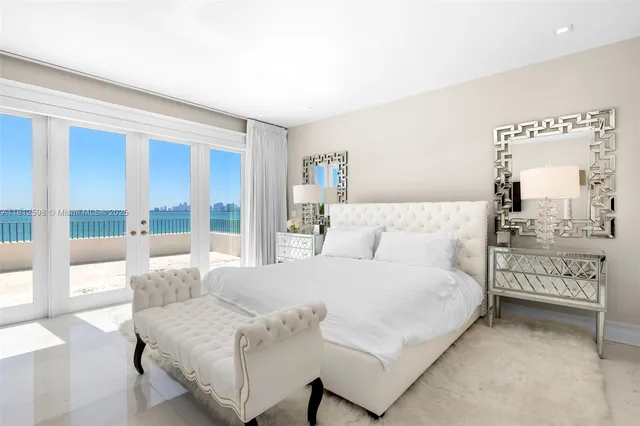 a spacious bathroom with a tub sink and mirror
