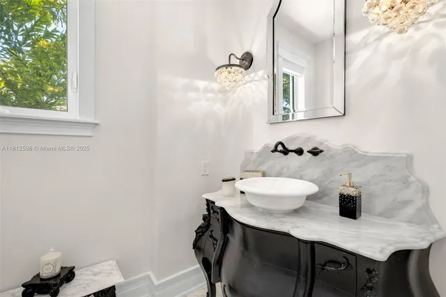 a bathroom with a double vanity sink and a mirror