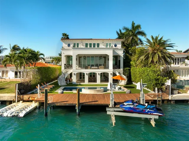 a front view of multi story residential apartment building with yard