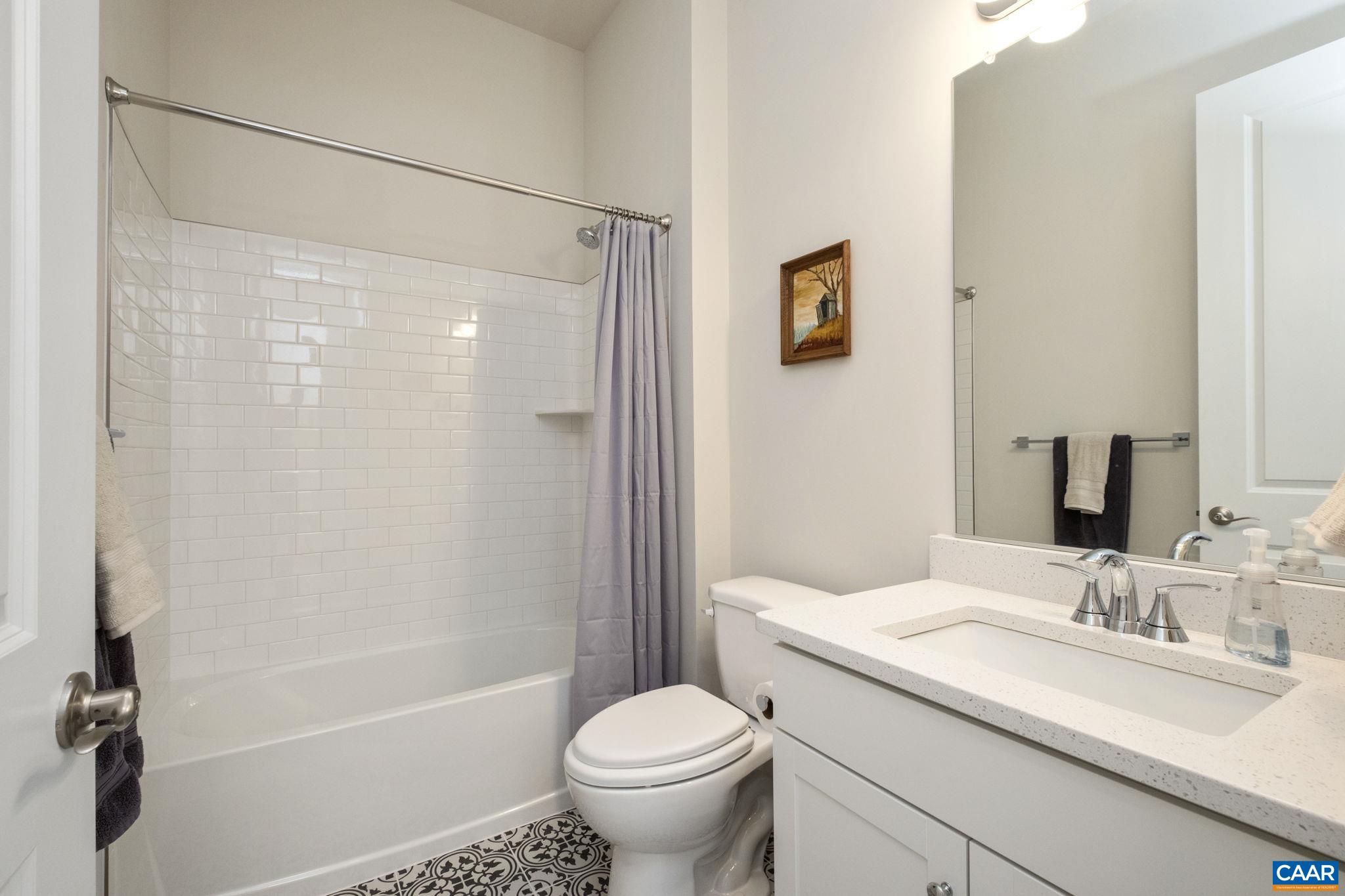 124 Stodghill Drive Ruckersville, VA 22968 - Photo 14 of 58 a bathroom with a granite countertop sink toilet and shower