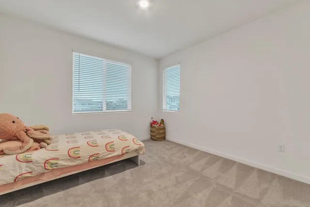 a bedroom with a bed and cabinets