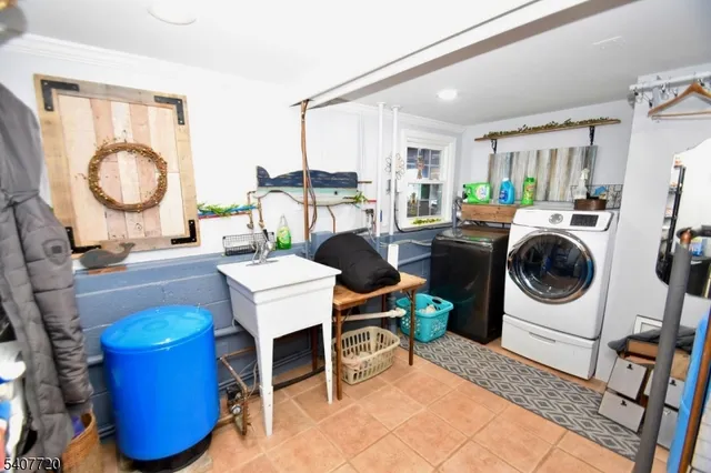a living room with furniture a flat screen tv and a window