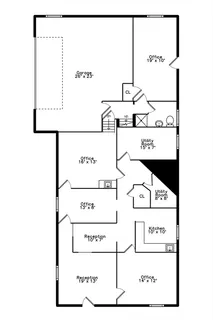 a view of a house with a yard covered in snow