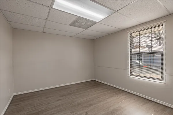 a view of a room with a windows and a bathroom