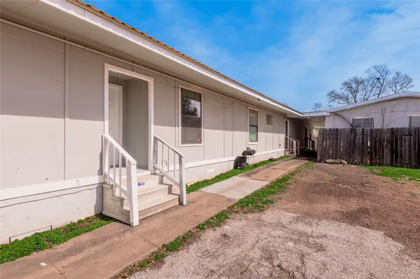 a house view with a backyard space