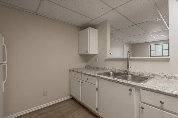a kitchen with a sink and cabinets