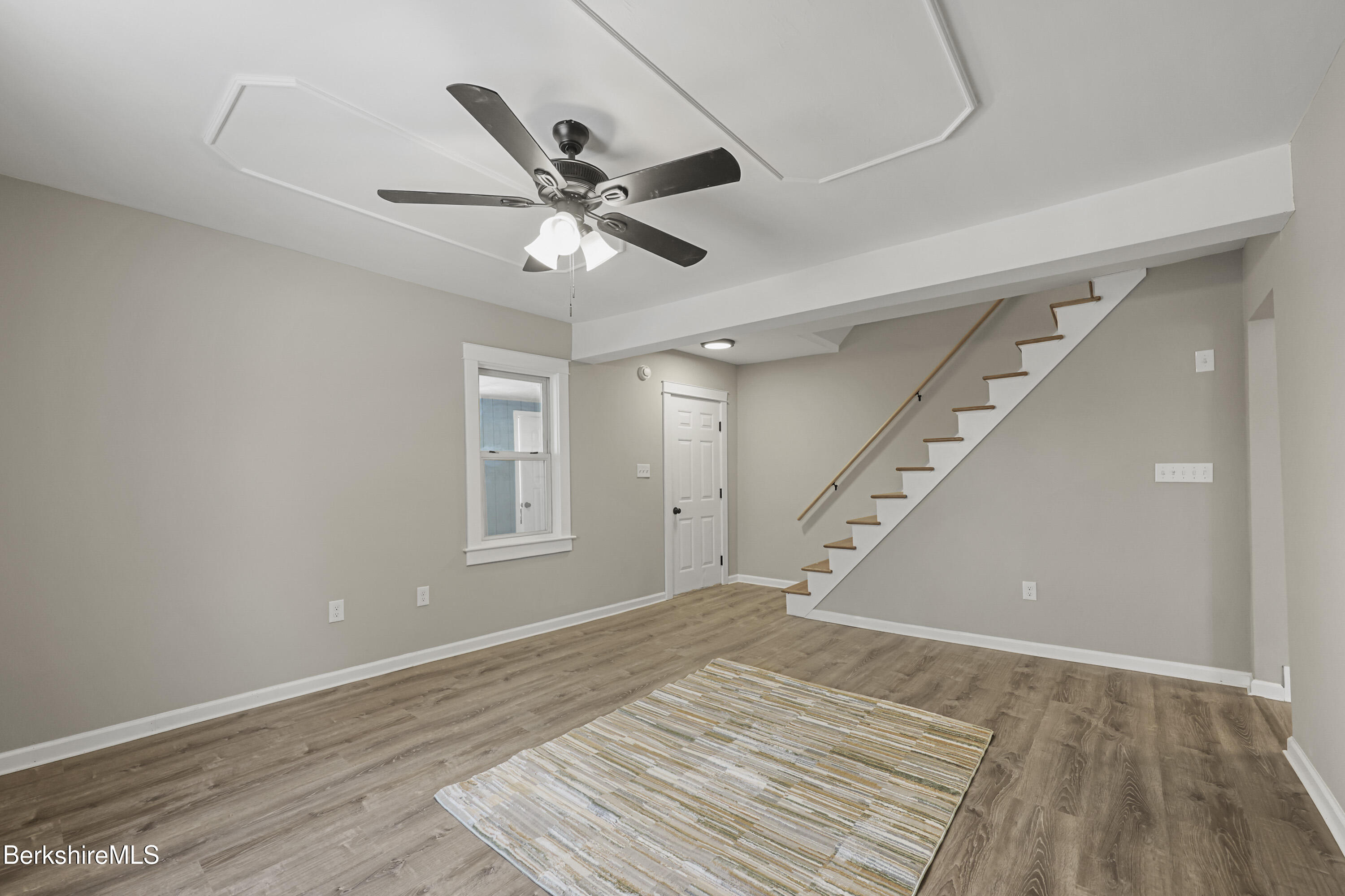 123 Broadview Terrace Pittsfield, MA 01201 - Photo 14 of 34 a view of an empty room with wooden floor and a ceiling fan