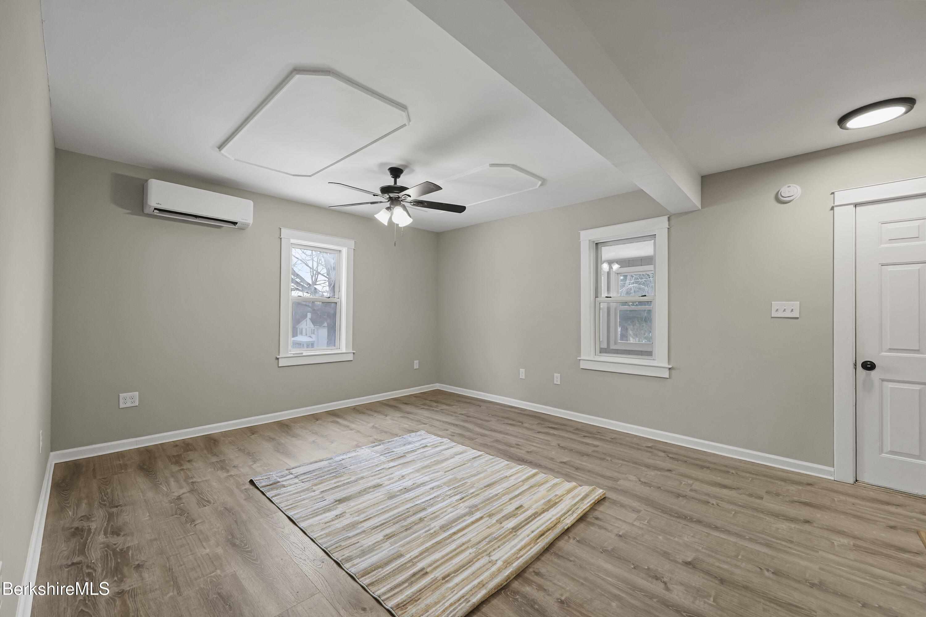 123 Broadview Terrace Pittsfield, MA 01201 - Photo 17 of 34 a view of an empty room with a window and wooden floor