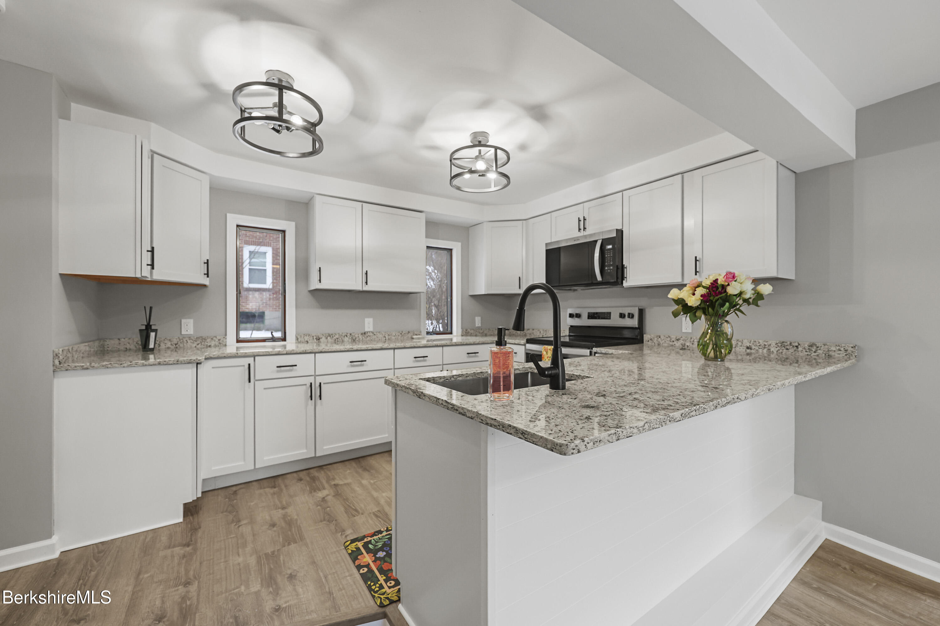 123 Broadview Terrace Pittsfield, MA 01201 - Photo 9 of 34 a kitchen with stainless steel appliances granite countertop a sink dishwasher a stove top oven a refrigerator with island and cabinets