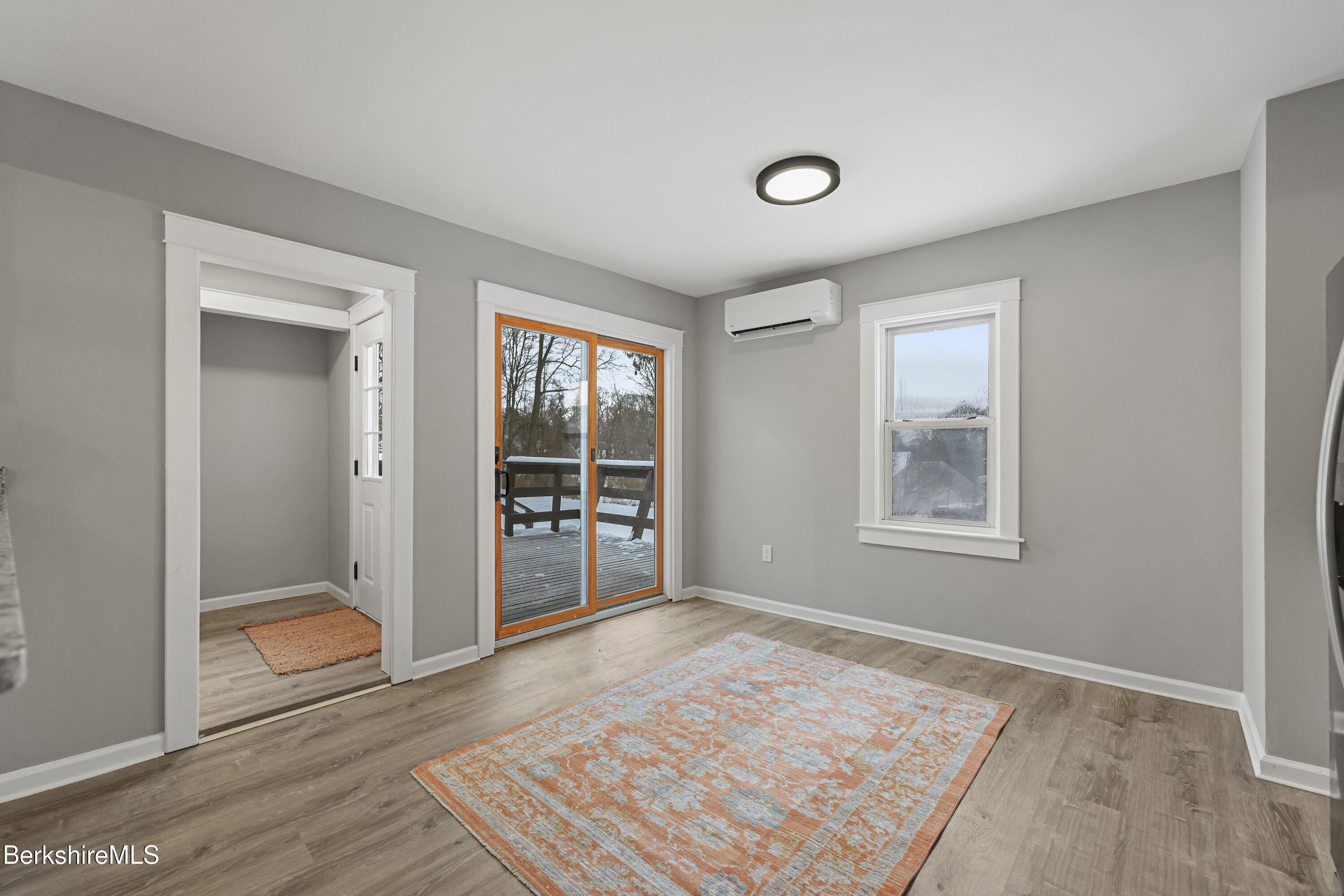 123 Broadview Terrace Pittsfield, MA 01201 - Photo 10 of 34 an empty room with wooden floor and windows