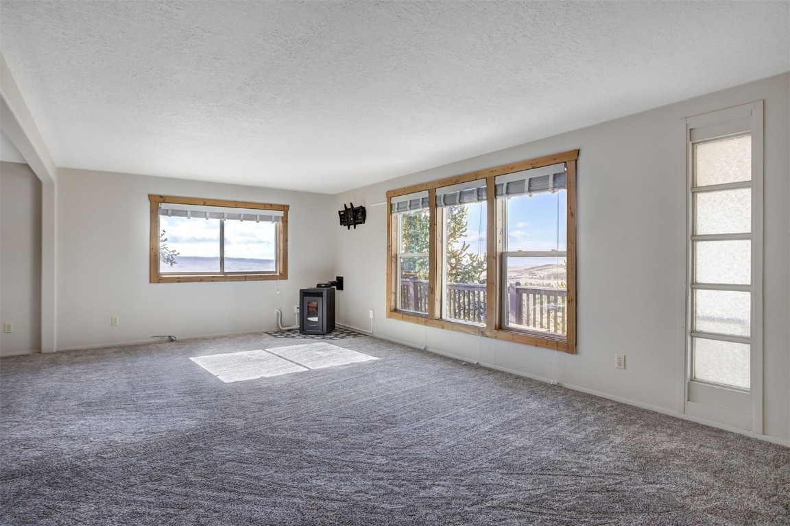 255 Park View Drive Fairplay, CO 80440 - Photo 4 of 37 upper level living room with new pellet stove