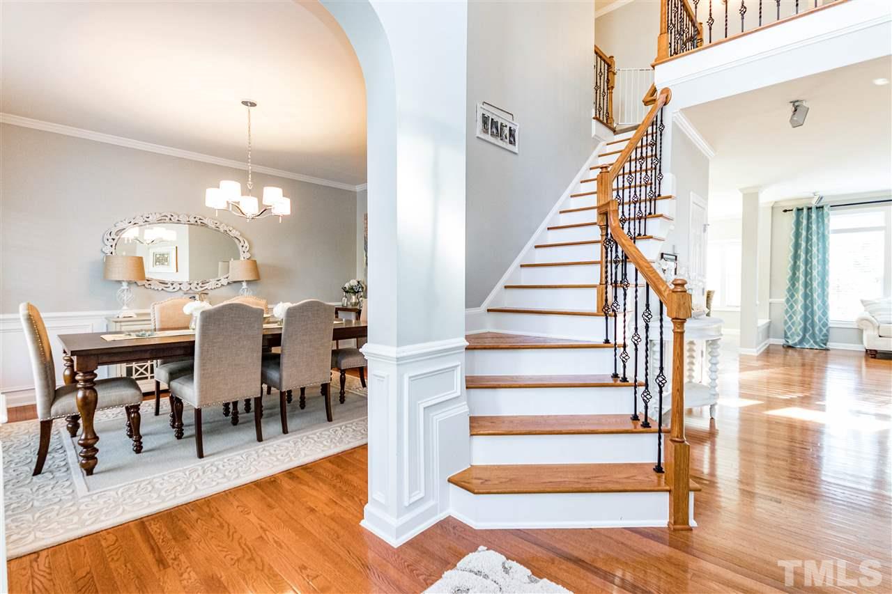 8240 Clarks Branch Drive Raleigh, NC 27613 - Photo 3 of 30 a view of a dining room with furniture and wooden floor