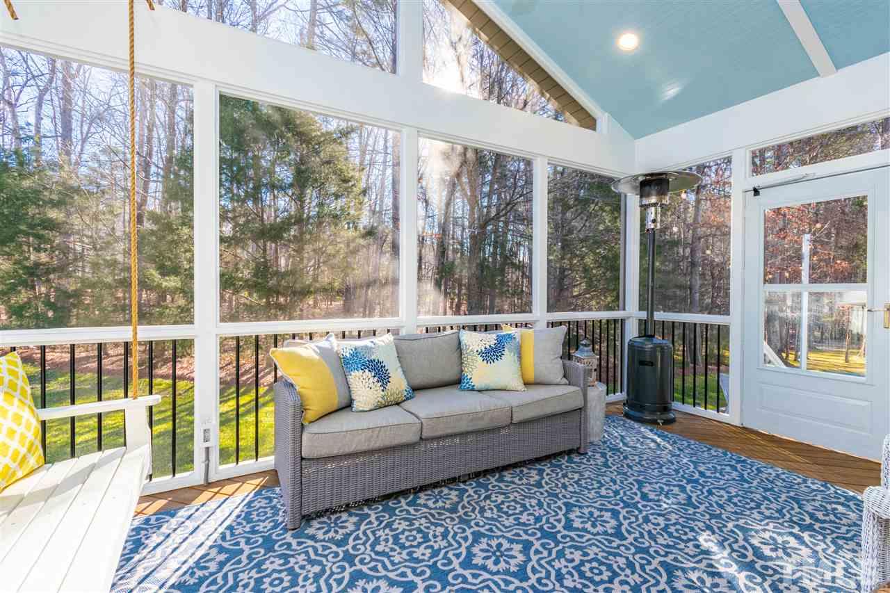 8240 Clarks Branch Drive Raleigh, NC 27613 - Photo 28 of 30 a living room with furniture and a large window