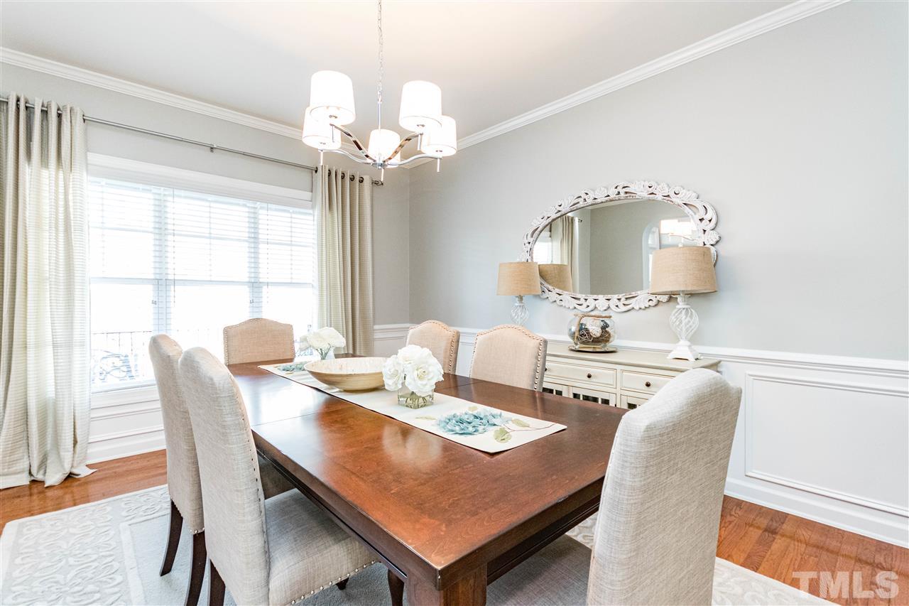 8240 Clarks Branch Drive Raleigh, NC 27613 - Photo 5 of 30 a view of a dining room with furniture and chandelier