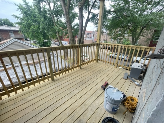 2159 West Huron Street, Unit 2R Chicago, IL 60612 - Photo 11 of 13 a view of deck with wooden floor and outdoor seating