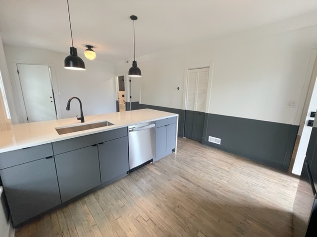2159 West Huron Street, Unit 2R Chicago, IL 60612 - Photo 6 of 13 a kitchen with a sink and cabinets