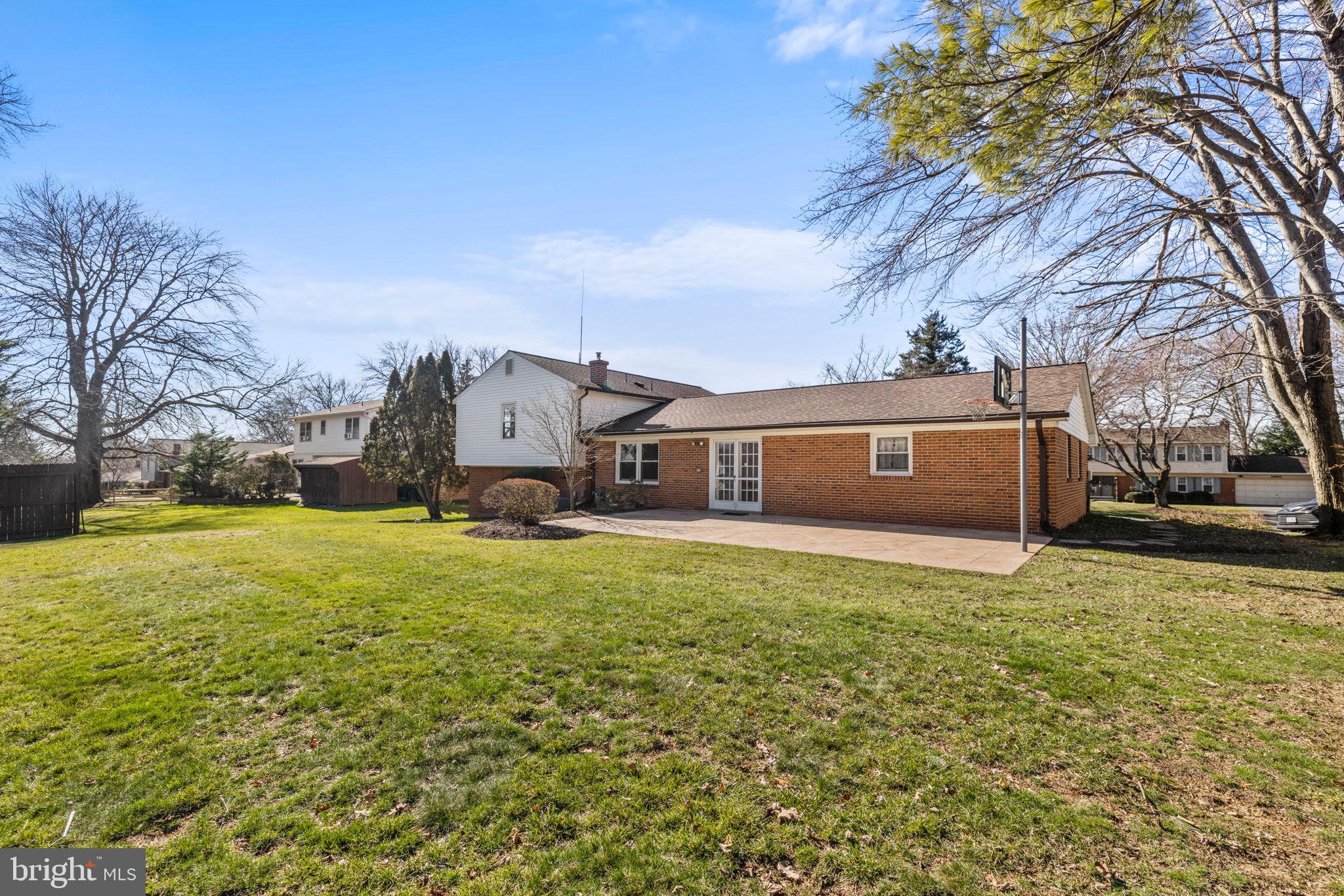 14801 Cobblestone Drive Silver Spring, MD 20905 - Photo 27 of 29 Expansive rear patio with yard views