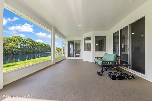 a aerial view of a house with a yard table and chairs