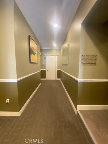 a view of a hallway with an empty room