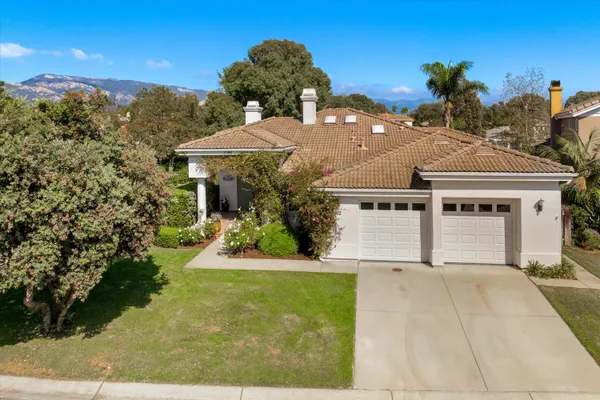 a front view of a house with yard