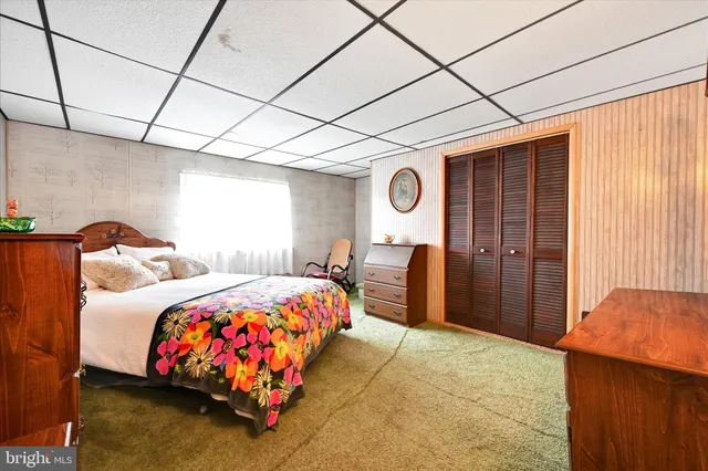 a bedroom with bed and a window